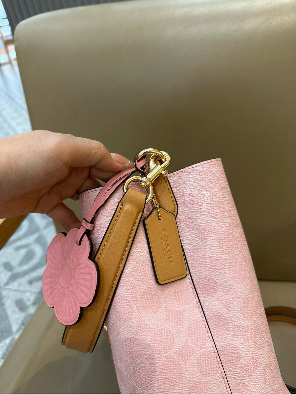 Coach Pink Pebble Leather Drawstring Bucket Bag with Tan Trim and Floral Charm - Picture 8 of 9